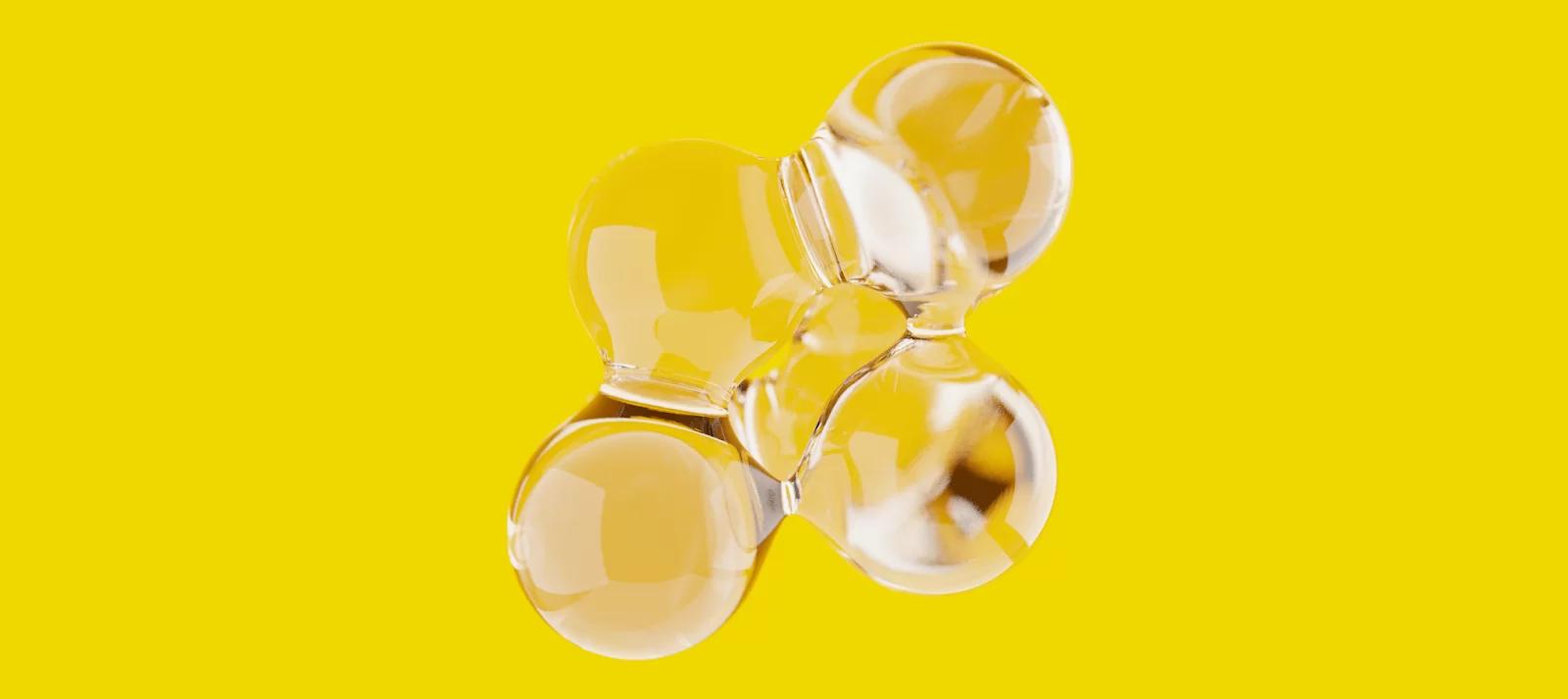 Abstract transparent glass object on yellow background